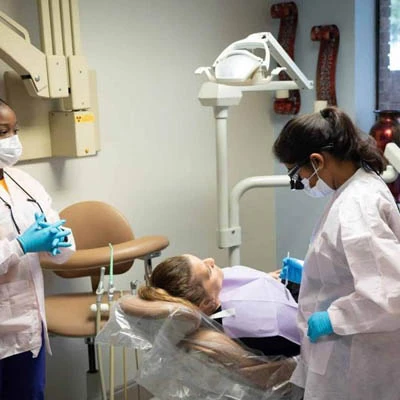 Dr. Joseph providing dental care to a patient at Midtown Dental