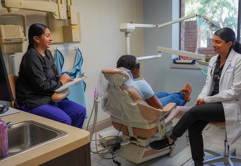 Dr. Tina Joseph speaking with a female patient about her upcoming treatment plan at Midtown Dental